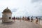 Tourists on observation deck on Roman hill admire beautiful view of Promenade des Anglais in Nice, France