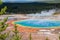 Tourists observe Grand Prismatic Spring from a boardwalk