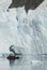 Tourists observing a glacier on the Antarctica, Paradise bay, Antartic