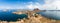 Tourists observing the Panoramic view from the top of Padar Island in Komodo National park, Lubuan Bajo, Indonesia