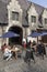 Tourists at outdoor cafe in centre of the medieval town Ghent in