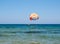 tourists on a parachute above the beach in Malia. Crete, Greece