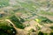 Tourists paragliding over watered rice terraces. This is a very famous site for paragliding in Northern Vietnam.