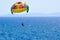 Tourists parasailing on aegean sea in Kusadasi, Turkey