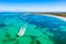 Tourists parasailing near Bavaro Beach, Punta Cana in Dominican Republic. Aerial view of tropical resort