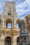 Tourists pass souvenir shops next to the Arenes d`Arles, Roman Amphitheater