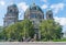 Tourists pass on street outside historic Berlin Cathedral