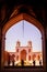 Tourists and persian locals in a multi-colored mosque Nasir al Mulk.