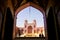 Tourists and persian locals in a multi-colored mosque Nasir al Mulk.