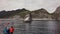 Tourists photograph Rookery of Steller Sea lions near Russkaya Bay southwestern part of the Avacha Gulf of the Pacific