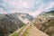 Tourists Are Photographed On Edge Of The Gudskoye Gorge In Georg