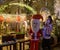 Tourists are photographed with Santa Claus in the evening at the German Colony in Haifa, northern Israel