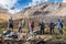 Tourists-photographers on a halt on a mountain slope