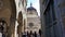 Tourists in Piazza Duomo with Cappella Colleoni chapel, view from Piazza Vecchia, Bergamo, Italy