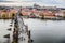 Tourists at Prague Charles Bridge. Prague with Vltava river. Cityscape with mass tourism