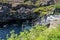 Tourists prepare to snorkel between the two tectonic plates at the steps to