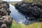 Tourists prepare to snorkel between the two tectonic plates at the steps to enter the cold water at Silfra