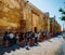 Tourists queue in front of detail facade of Mosque-Cathedral, Cordoba, Andalusia, Spain, also known as the Mezquita