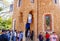 Tourists queuing in front of the Porterâ€™s Lodge Pavilion in Park Guell.