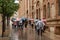 Tourists in the rain touring the spectacular Benedictine monastery of Holy Mary of Montserrat
