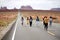 Tourists reenacting a scene from the movie Forrest Gump near Monument Valley, Utah