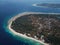 Tourists relax on the white beach of the island. Tropical white sand beach. Seascape with tropical islands. Bautiful ocean