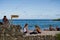 Tourists relaxing in Alemanes Beach in Santa Cruz