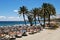 Tourists relaxing on Daitona beach, Marbella, Spain.