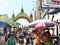 Tourists and religious pilgrims by an arch near Golden Rock Kyaiktiyo Pagoda, Myanmar