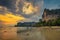 Tourists rest at the Railay Beach before sunset