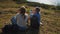 tourists rest on top of mountain during backpacking, two young women relaxing