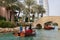 Tourists rest on traditional wooden arabic boats in Madinat Jumeirah