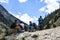 Tourists resting during trek to Fairy Meadows grassland