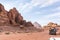 Tourists ride on the black Toyota tender through vast expanse of the red desert of the Wadi Rum near Amman in Jordan