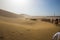 Tourists ride Camel over Sunshine Summer Desert