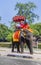 tourists ride on an elephant in the Historical Park in Ayutthaya