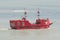 Tourists ride in a giant red pirate boat in the ocean at Virginia Beach.