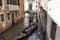 Tourists ride gondolas tour on canals