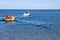 Tourists ride the inflatable watercraft boat at the Black sea