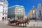 Tourists riding horse-drawn carriage. Hofburg.Vienna, Austria