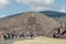 Tourists on the road of the dead against the backdrop of the pyramid of the moon. Teotihuacan. Mexico city