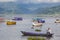Tourists in rowboat symbol of Phewa lakeside in Pokhara.