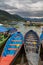 Tourists in rowboat symbol of Phewa lakeside in Pokhara.