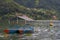 Tourists in rowboat symbol of Phewa lakeside in Pokhara.