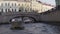 Tourists sail along the river along the city of St. Petersburg.