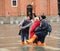 Tourists in San Marco square with high tide, Venice, Italy.