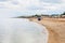 Tourists on sand and shelly beach Sea of Azov