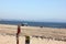 Tourists on Santa Cruz Harbor Beach, California, USA