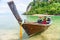 Tourists on a sea walk on a traditional Thai boat long tail