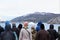 Tourists on ship deck vying for view of iceberg